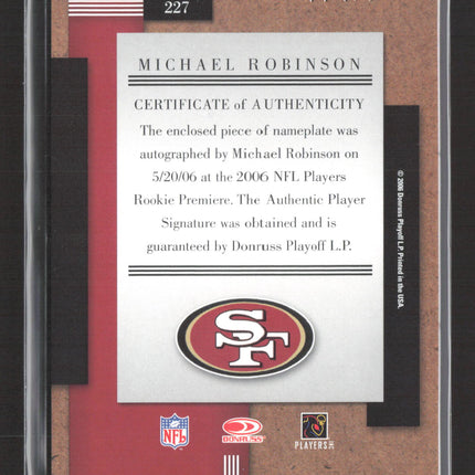 2006 Donruss Playoff Threads Michael Robinson #227 Piece of nameplate Auto /240